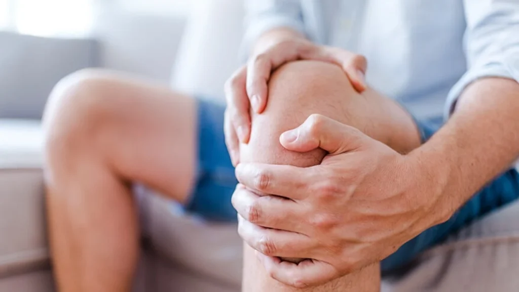 Advanced chiropractic treatment being applied to a patient's knee - Greenlight Chiropractic & Wellness Lab